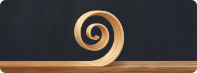 The logo: a curled wood shaving on a workbench