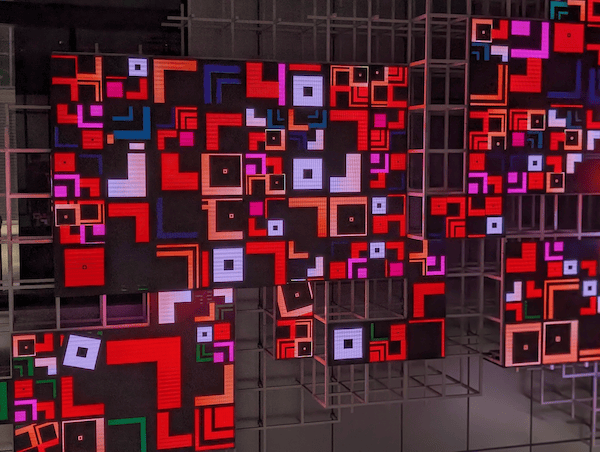 The original PNG file is a photo of a media art placed in a slightly darker space.