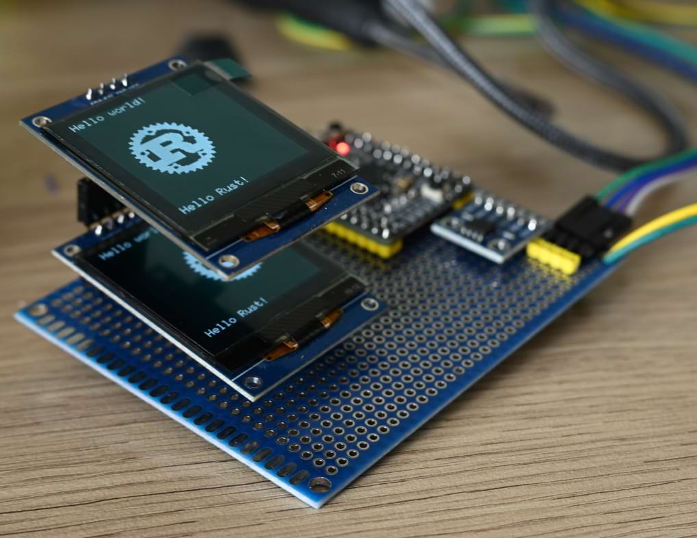 SH1107 SPI and I2C display modules showing the Rust logo