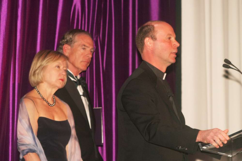 <b>Capital Campaign 1</b><br /> Photo of University of Scranton President Scott R. Pilarz, S.J., with Mr. and Mrs. Condron onstage at the launch of the 125th anniversary Capital Campaign.