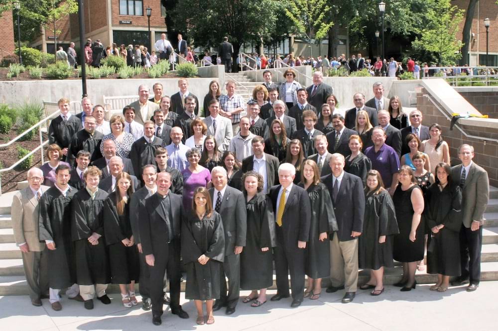 <b>Commencement 2009 legacy photo </b><br /> Father Pilarz poses with graduating seniors from the class of 2007 whose parents are also University of Scranton alumni.