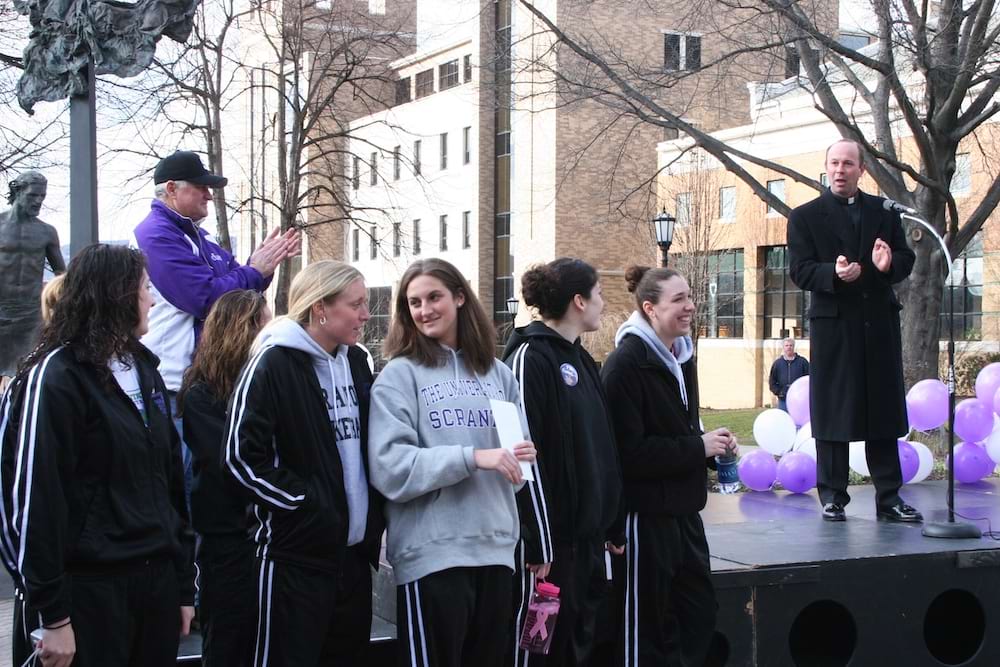 <b>Lady Royals sendoff for Final Four - 2006</b><br /> Father Pilarz with members of the University of Scranton Lady Royals basketball team, before they depart for the Final Four tournament in 2006.