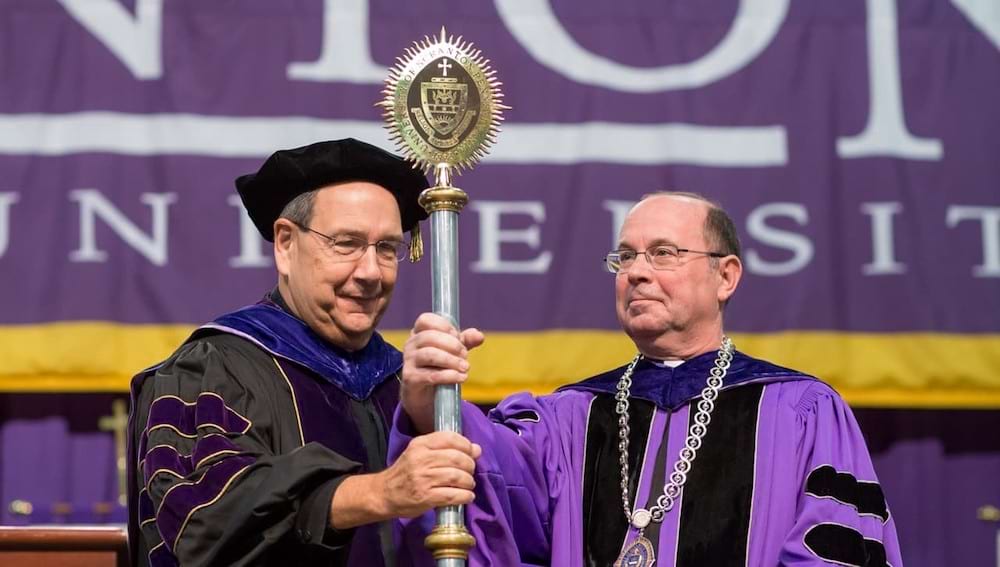 <b>Fathers Keller and Pilarz </b><br /> Father Keller presents the University mace to Father Pilarz at his second inauguration in 2018. 