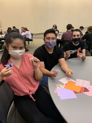 <b>Three students display origami figures they created during an origami workshop at The University of Scranton.</b><br /> 