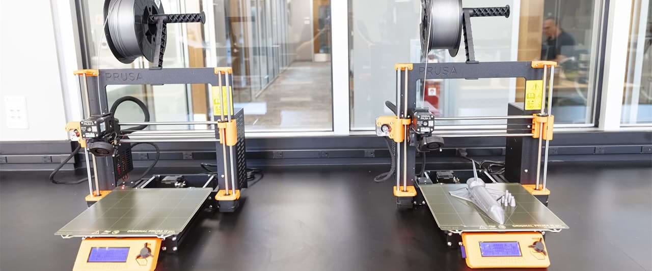 Close up view of two 3D printers in a mechanical engineering class 