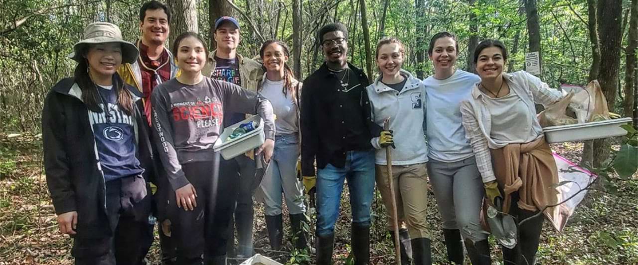  Nine biology students in a Florida forest for student life trip.