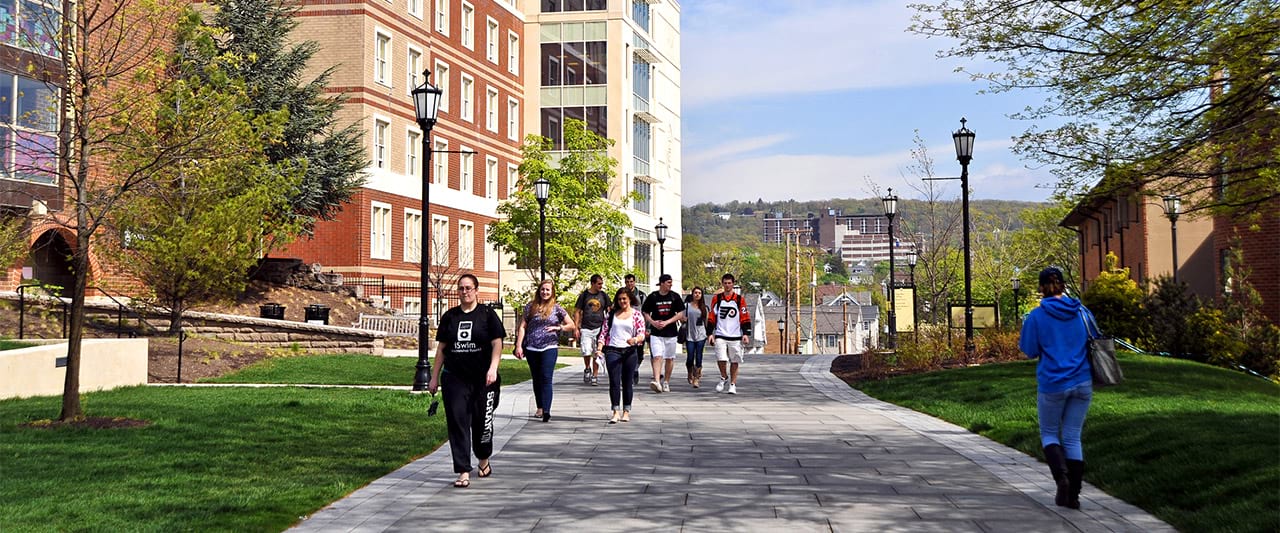  Students walking the hill from Condron Hall, the sophomore year on-campus housing, during the day. 