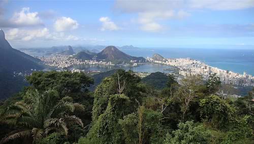 Taken from elevated area overlooking over the mountains, city, beaches and sea next to Rio de Janeiro. 