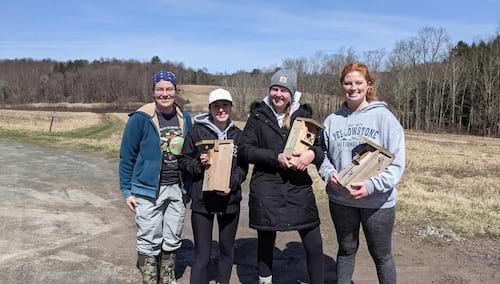 A biology professor interested in the field of bird behavior, Dr. Cara Krieg, shown at left, talks about her time in the University's biology department and her hands-on experience with wild animals living in their natural environment.