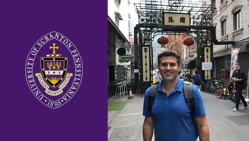 The University of Scranton Seal juxtaposed against a purple background and a man standing in the middle of a street.