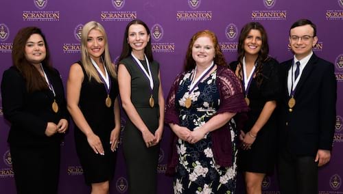 The University of Scranton recognized outstanding master’s and doctoral degree graduates at its 2023 graduate commencement events the weekend of May 19-21. Outstanding student award recipients from the Kania School of Management include, from left: Naushaba Khan Rasha, Scranton; Mary Kate Yatsonsky, Jefferson Township; Kimberly A. Stossel, East Stroudsburg; Laura B. Lamb, Oswego, New York; Christina F. Piscitelli, New City, New York; and Charles M. Csaszar, Hopewell Junction, New York.