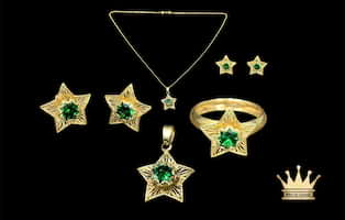 18karat gold emerald with star design female necklace set(ring charm earring pair & chain )weight 5.660