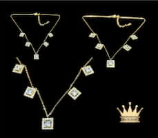 18karat gold female charm necklace adjustable size weight 6.540 price $800.00