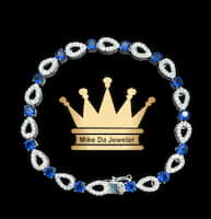 925 sterling silver tennis bracelet with cubic zirconia stone and blue sapphires stone synthetic price $250 dollars weight 10.6 grams 7.5 inches 5 mm
