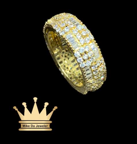 18k yellow gold band with cubic zirconia stone on it price $720 usd weight 6.71 gram size 8.5 7mm all stone with prong setting