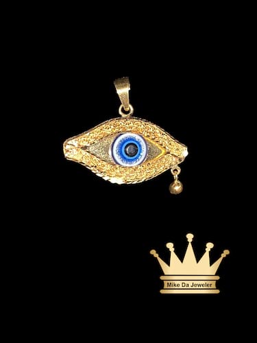 21 karat gold egyption evil eye charm 1.00 inch wide and weight 2.610