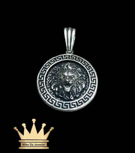 925 sterling silver solid handmade lion face pendant on border Versace design price $180 dollars weight 7.75 grams 1 inches