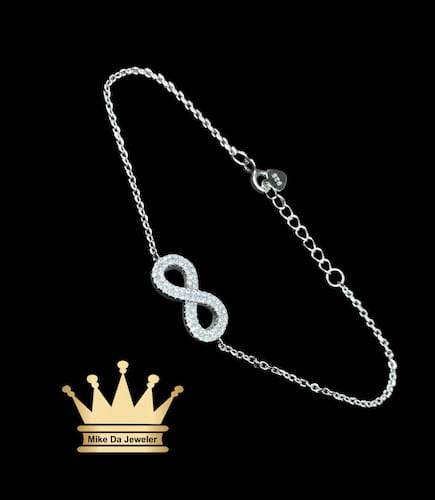 925 sterling silver solid handmade female infinity bracelet with cubic zirconia stone dipped in white gold price $125 dollars weight 2.68 gram 8 inch