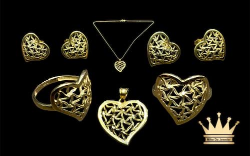 18karat gold heart design female necklace set (ring charm earring pair & chain )weight 9.630
