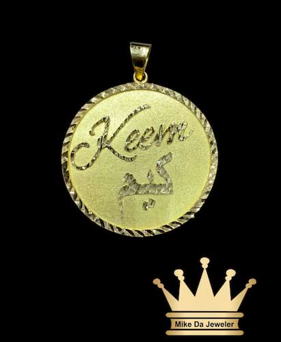 18k handmade customized solid circle pendant with English and Arabic name on it border and letter diamond cut price $1250 dollars weight 11.5 grams size 1.5 inches