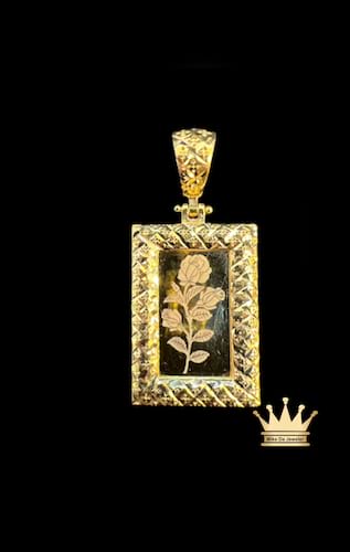21k gold flower style gold pendant rectangle shape/ edges in diamond cuts grams 5.15 price $710