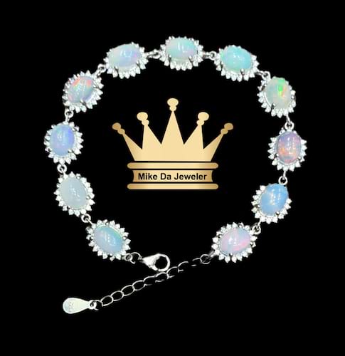 925 sterling silver Natural opal tennis bracelet price $1300 dollars weight 13.45 grams size 7.5 inches opal size 5.8/7.5 mm