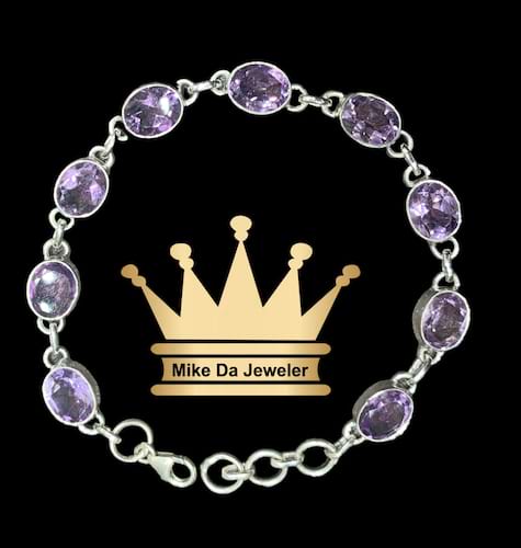 925 sterling silver handmade Natural amethyst stone tennis bracelet price $950 dollars weight 10.75 grams size 7.5 inches size of the stone is 6.5/8.5 mm