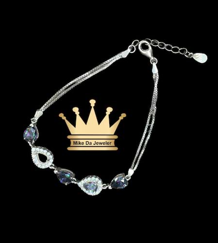 925 sterling silver tennis bracelet with cubic zirconia alexandrite dipped in white gold    weight 6.98 grams 7.5 inches