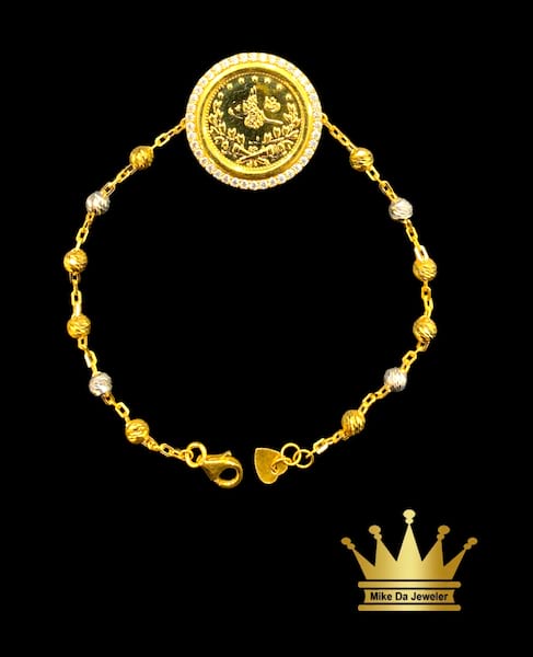 21 k yellow and white gold with cubic zirconia Kuwait gold coin bracelet size 7.5 inch weight 7.770mg