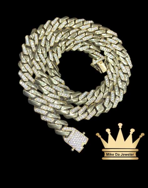 18k semisolid Miami Cuban link chain with cubic zirconia stone in it  weight 57.70 gram 22 inches 9mm