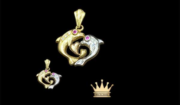 Gold two tone dolphin charm 18Karat size 0.75inch weight 5.340