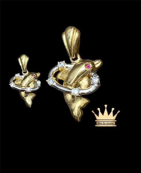 18karat gold two tone dolphin charm size 0.75inch  weight4.450