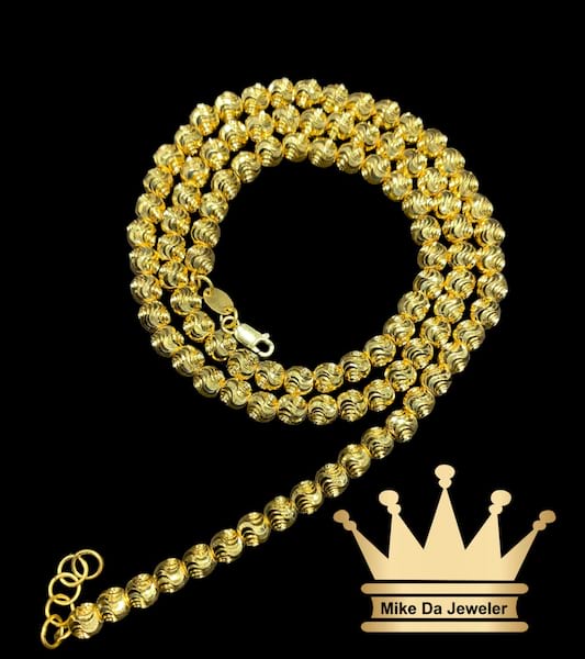 21k yellow gold handmade moon cut chain fully diamond cut    weight 33.52 grams 22 inches 5 mm