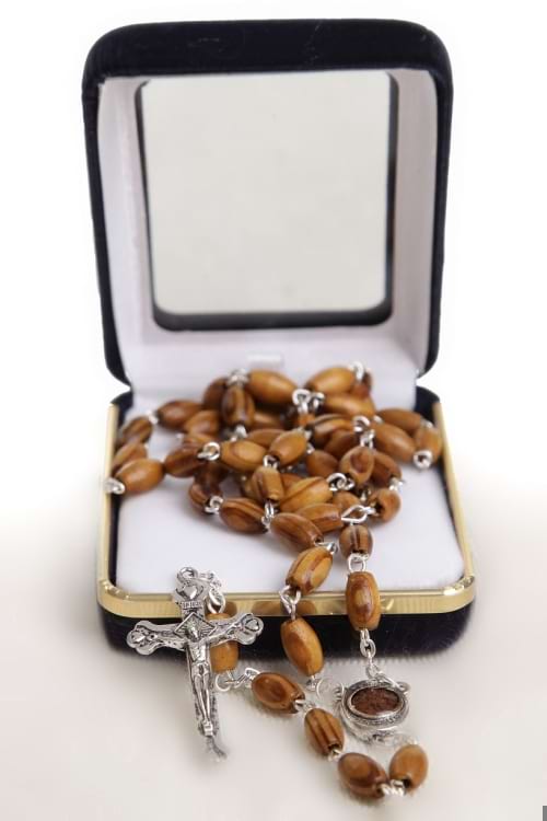 A Holy Land Olive Wood Rosary containing soil from the Baptism Site of Jesus Christ at the Jordan River